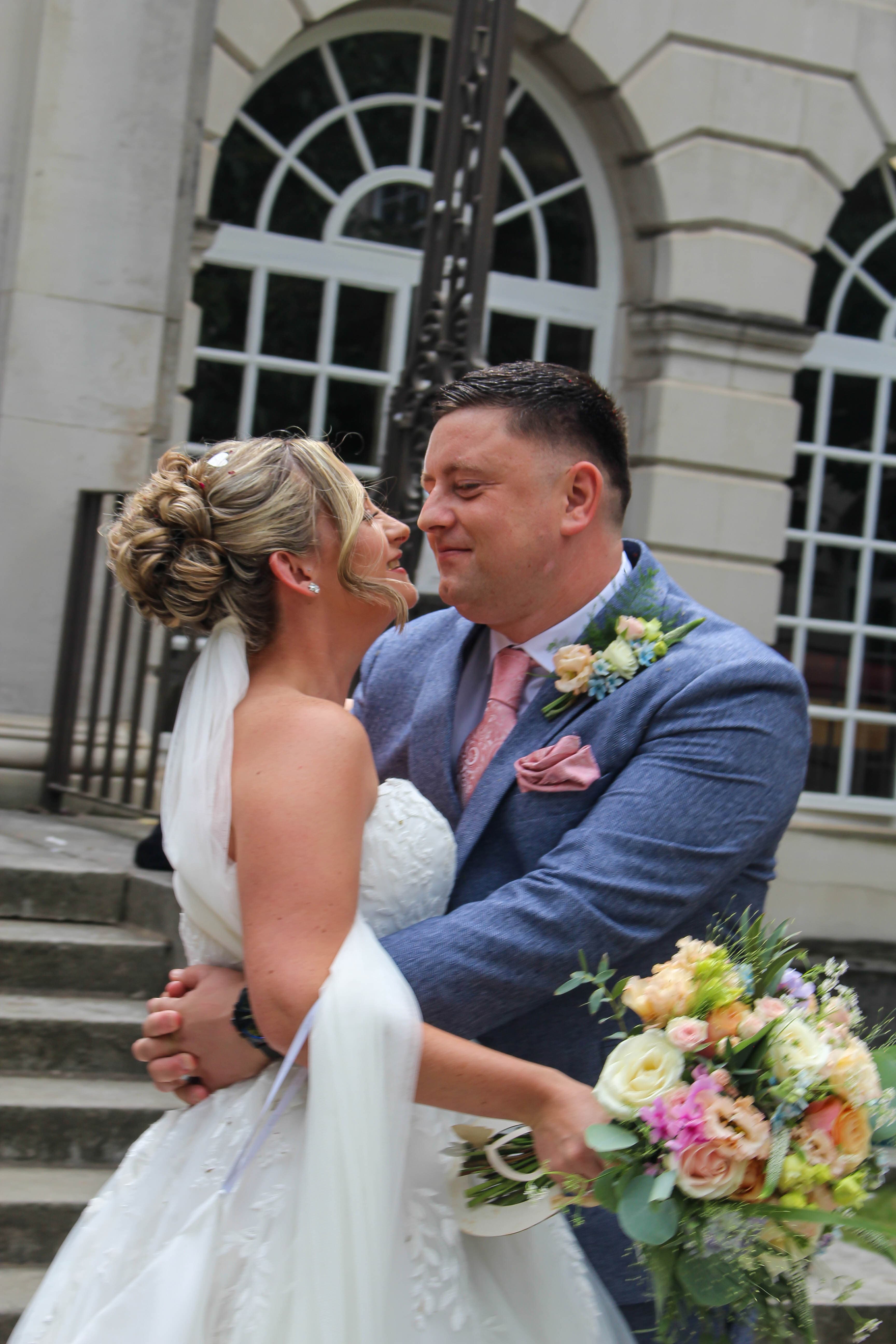 Wedding couple photographed outdoors
